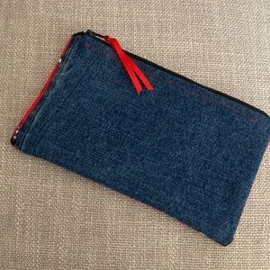 Handcrafted Denim Cosmetic Bag with Minnie Mouse accents.